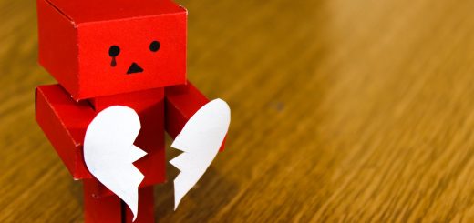 red amazon danbo on brown wooden surface