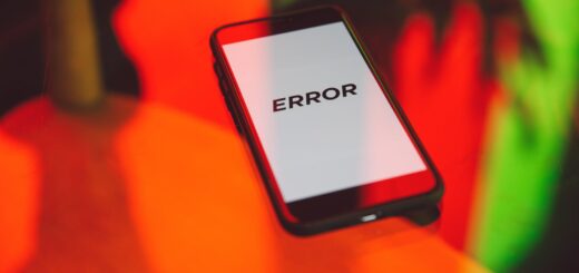 black smartphone on table