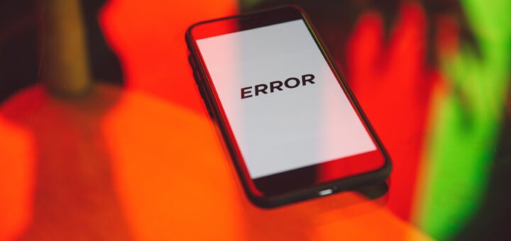 black smartphone on table